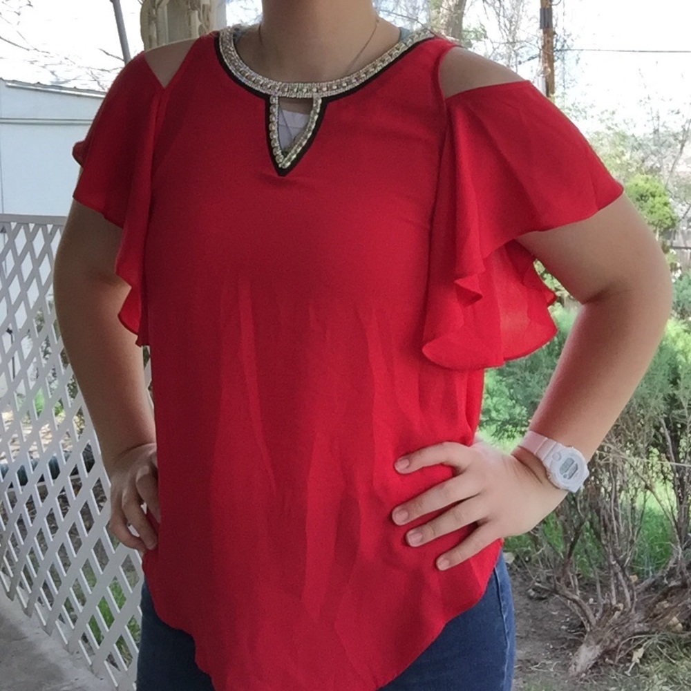 Red shoulder peak blouse